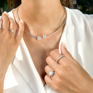 Model wearing white gold diamond wedding band by El Galla