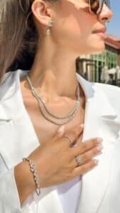 model wearing a double row diamond necklace and diamond bracelet by el galla