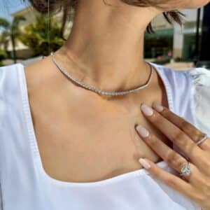 Model wearing a diamond tennis necklace by el galla