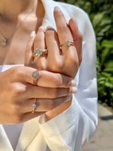 modela wearing solitaire ring floral ring and other two diamond rings by El Galla
