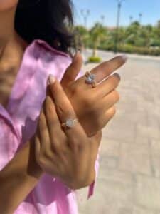 Model wearing Trouvaille Diamond Ring and Sunlit Oval Diamond Ring designed by el galla leading diamond jewelry store in egypt