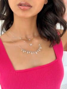 model wearing Butterfly Diamond Necklace and Diamond Shard Necklace