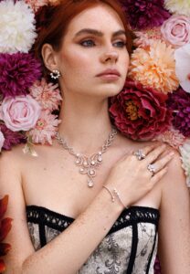 Elegant rose gold open hoop earring featuring seven sparkling diamonds and a latch closure